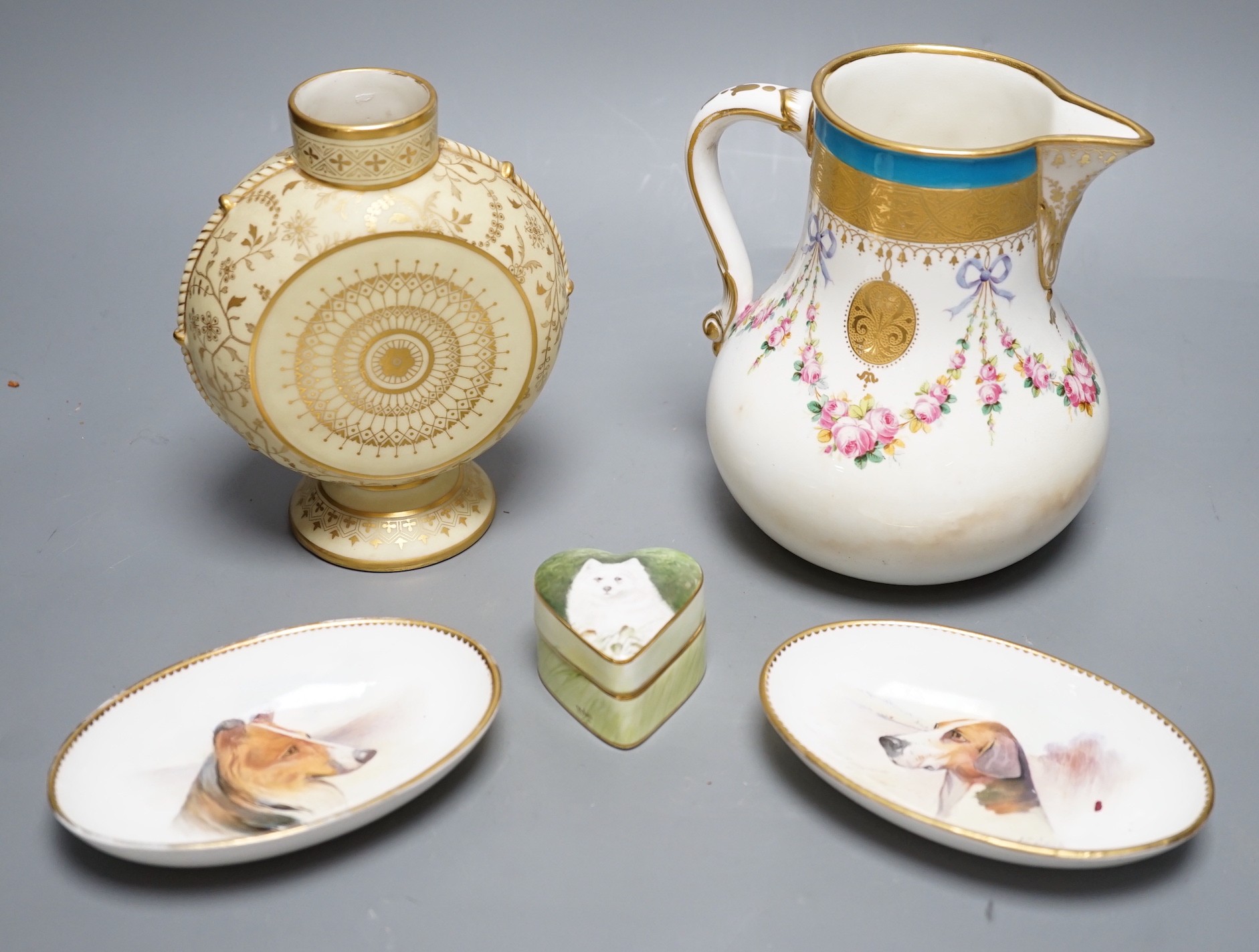 A Minton circular vase with base and neck elaborately gilded on a pale yellow ground, a Minton jug with gilded medallions, rose swags and a turquoise border, two Minton oval dishes painted with dogs by J.E. Dean, signed,